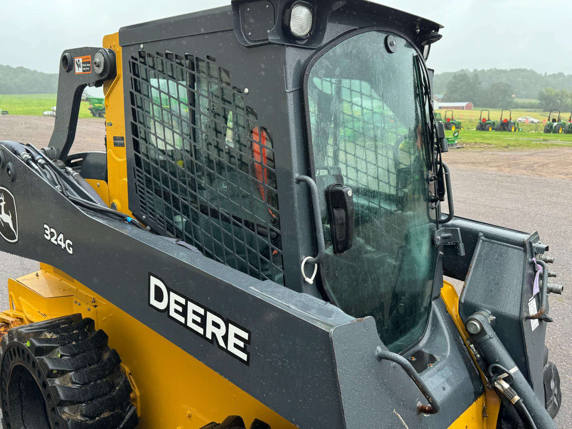 
								2022 John Deere 324G W/Bucket full									